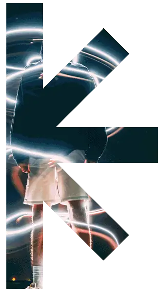 Left-half-ast – new classic – new classic Large letter K filled with an image of a dancer on a dark stage with neon light trails behind them.