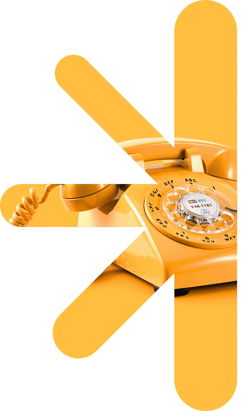 Half logo - phone – new classic – new classic Yellow rotary telephone visible through bold white abstract shapes