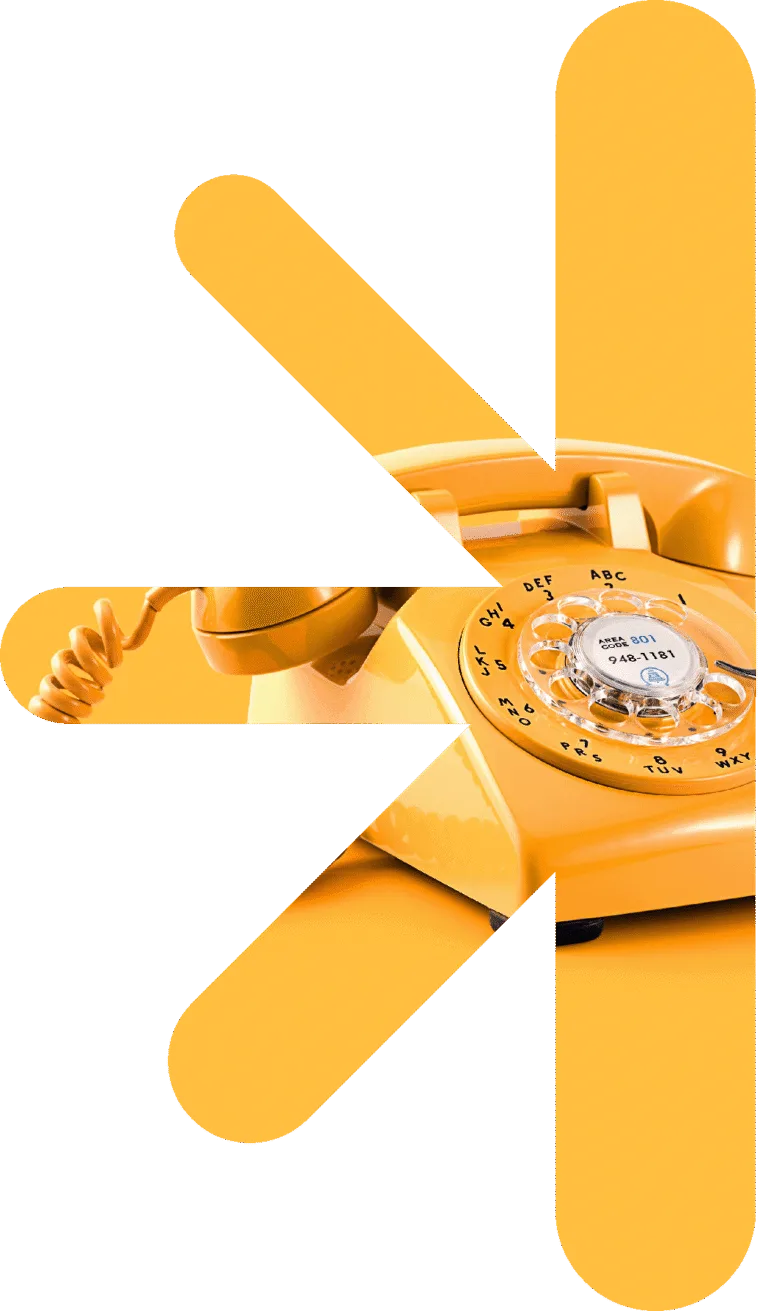 Half logo - phone – new classic – new classic Yellow rotary telephone visible through bold white abstract shapes